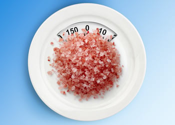 pink salt on a scale plate