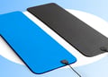Blue grounding mat and black pemf mat next to each other in blue background