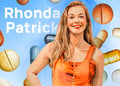 Rhonda Patrick standing behind a blue vitamins falling background