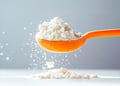 Orange spoon holding creatine