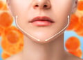 Half a face with arrows pointing to chin to reduce face fat in orange background